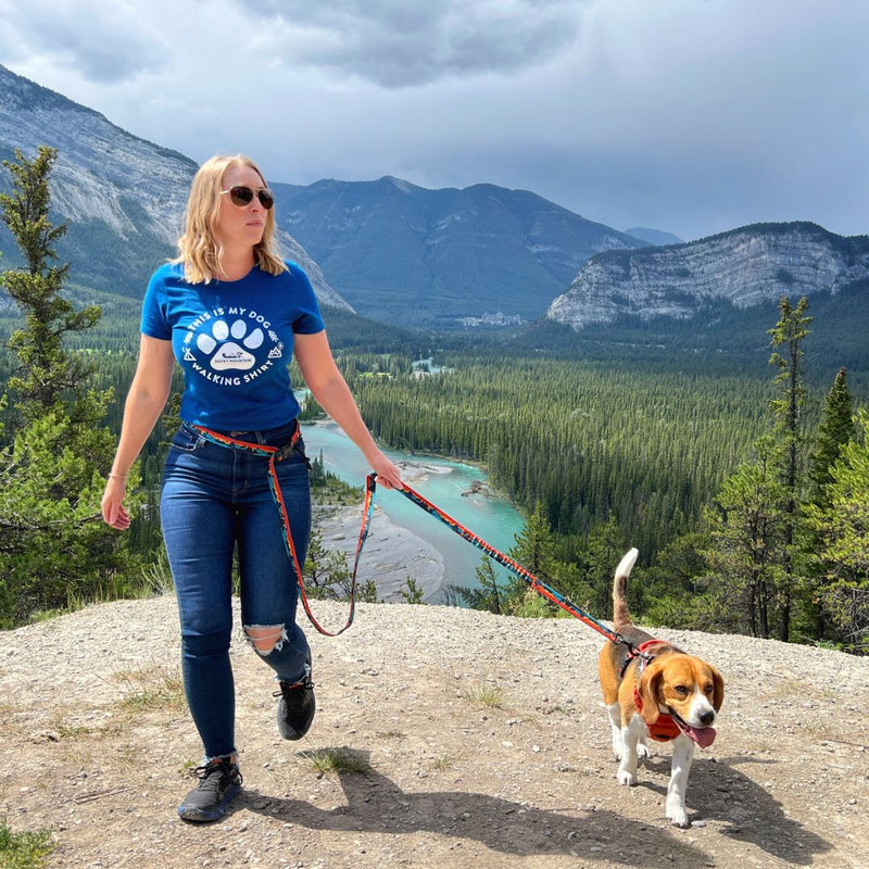 Load image into Gallery viewer, A woman walking a beagle on a red dog leash in hoodoos trail head, banff