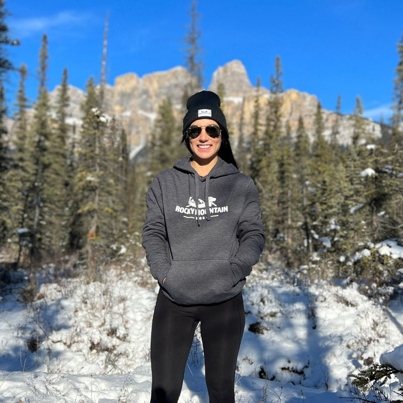 Load image into Gallery viewer, Female wearing a hoodie sunny day in banff alberta
