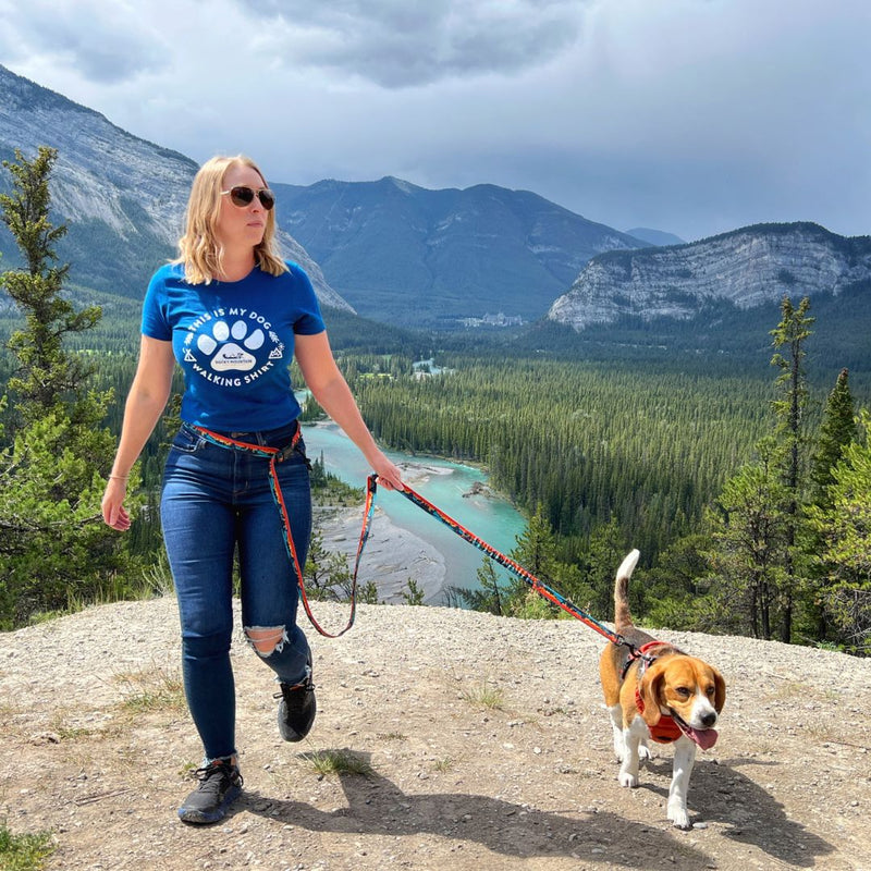 Load image into Gallery viewer, A woman walking a beagle on a red dog leash in hoodoos trail head, banff
